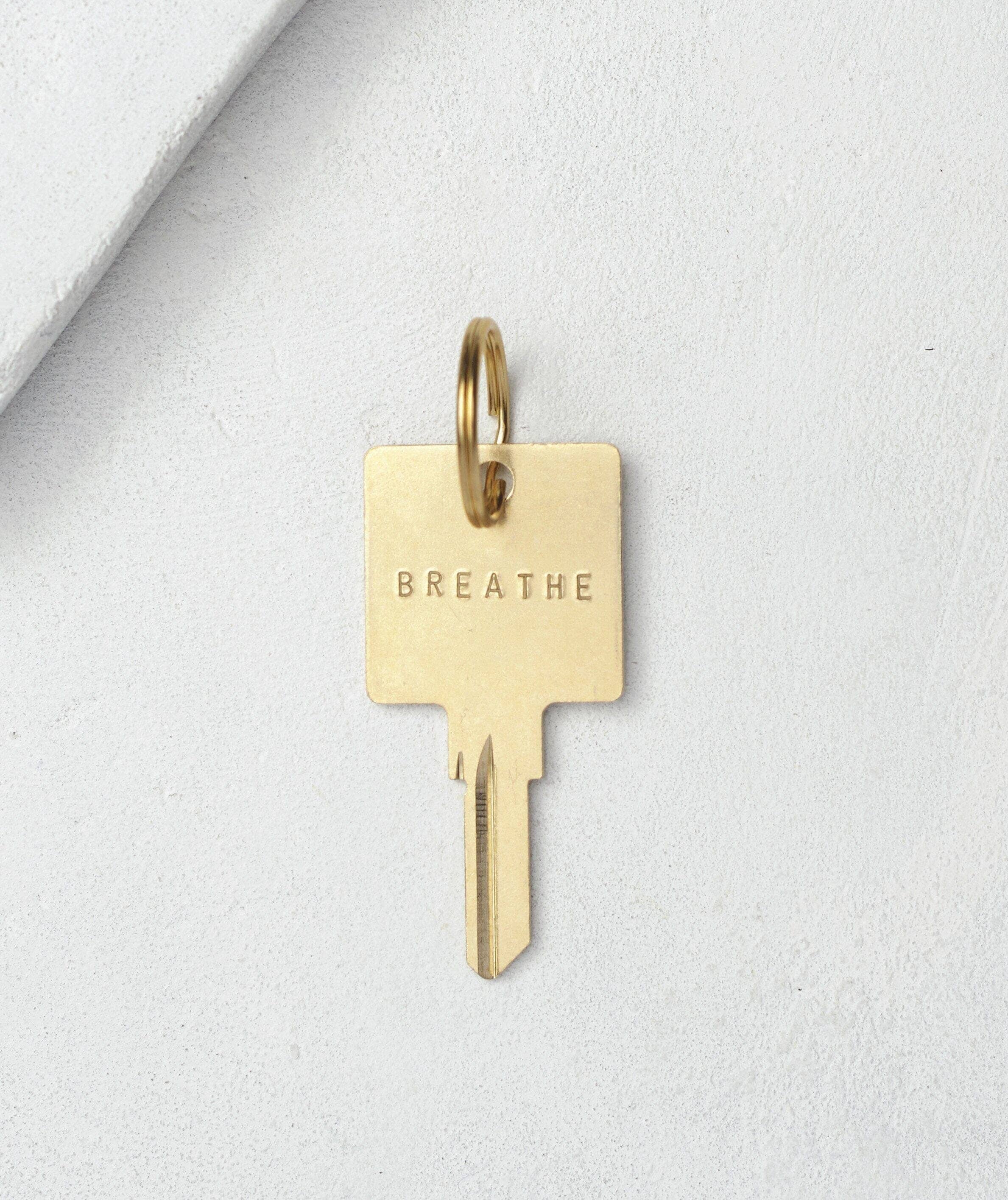 Original Keychain with Custom Hand Engraved Word | The Giving Keys